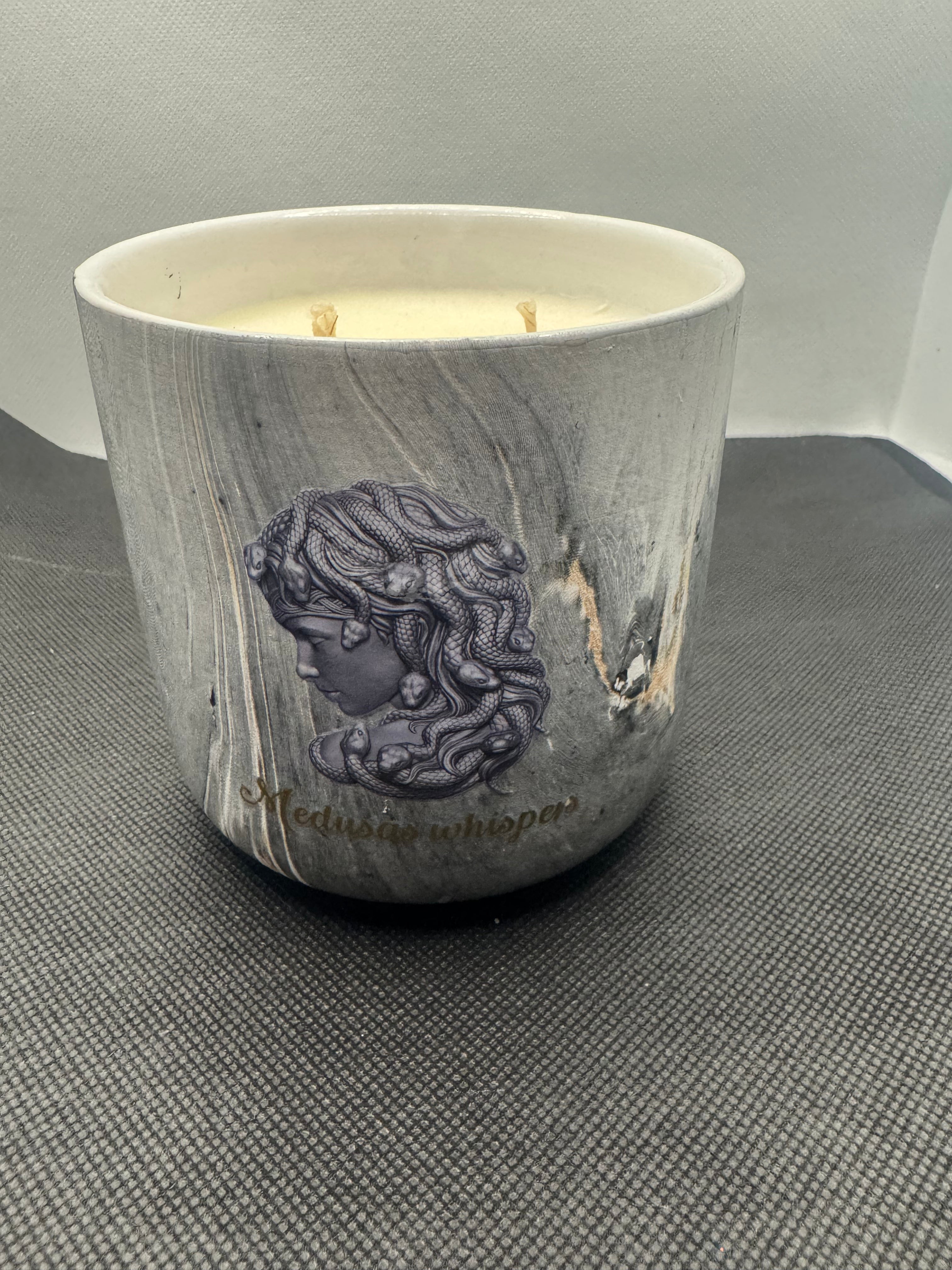 Large 500 gram candles in marble look jar.